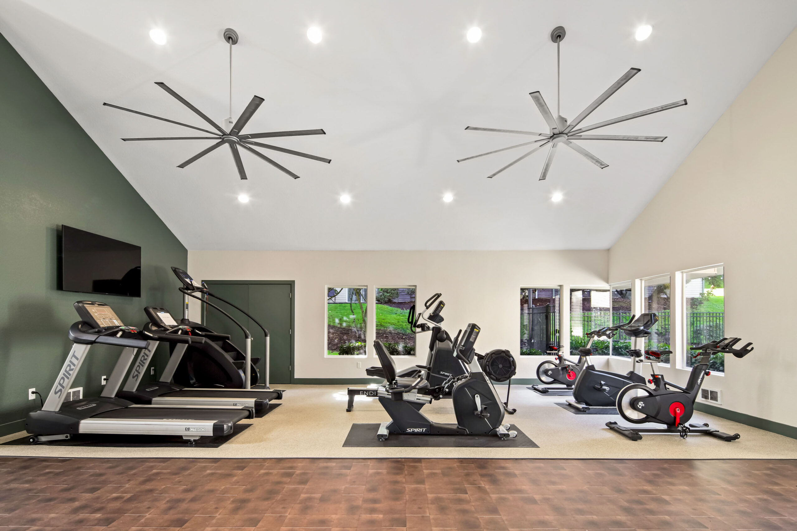 The fitness center includes a mix of cardio machines, free weights, and strength-training equipment for daily workouts.